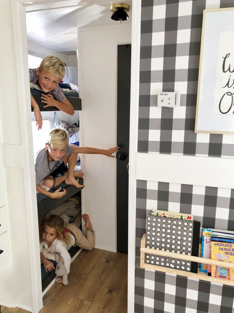 Their three young children sleep in triple bunk beds in the opposite end of the RV.