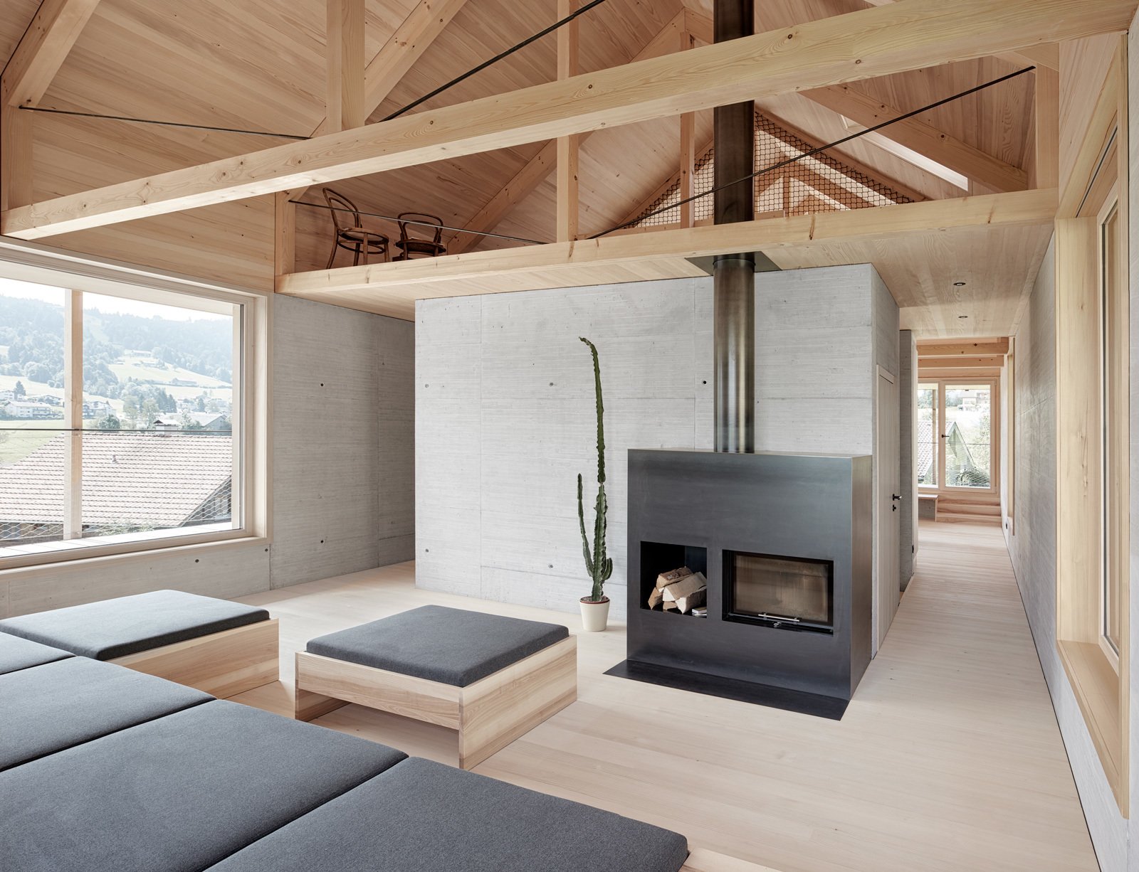 A small seating area is tucked into a loft-like space.