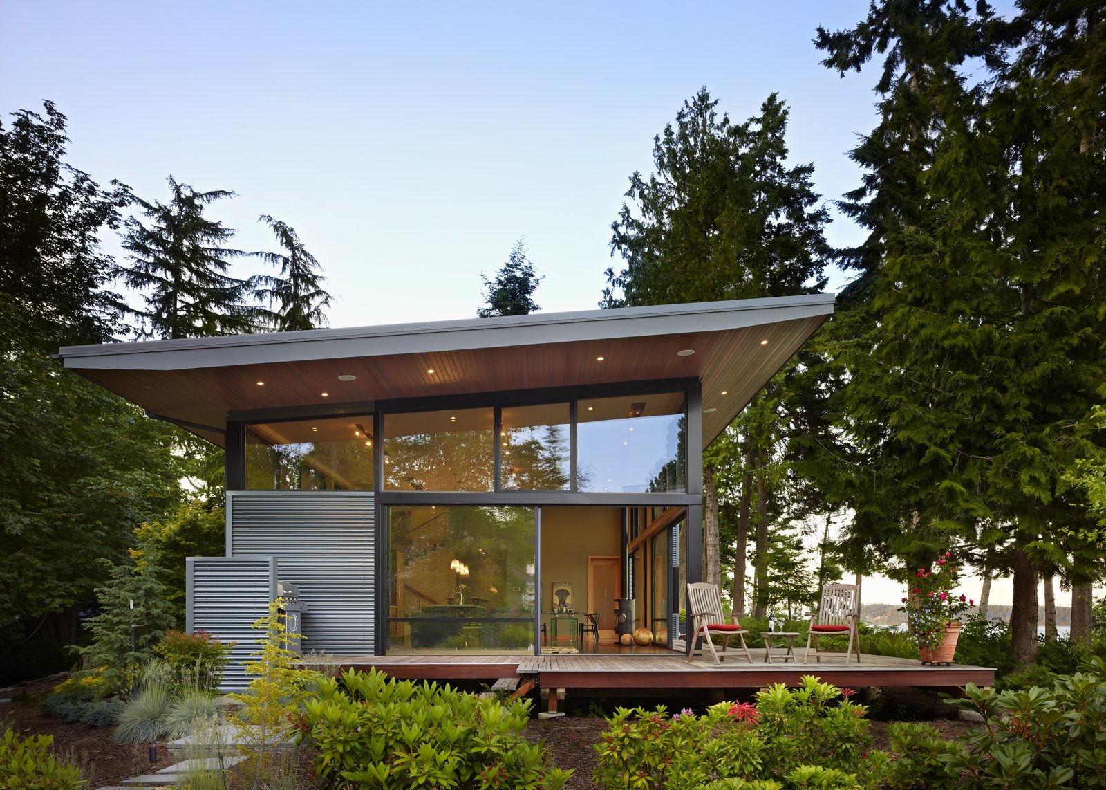 South side of house, with 6-ft roof overhangs and large sliding glass panels