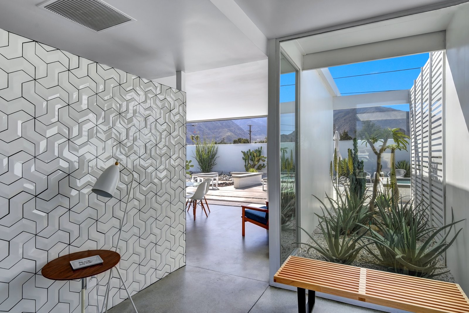 Walls of glass as you enter the home.