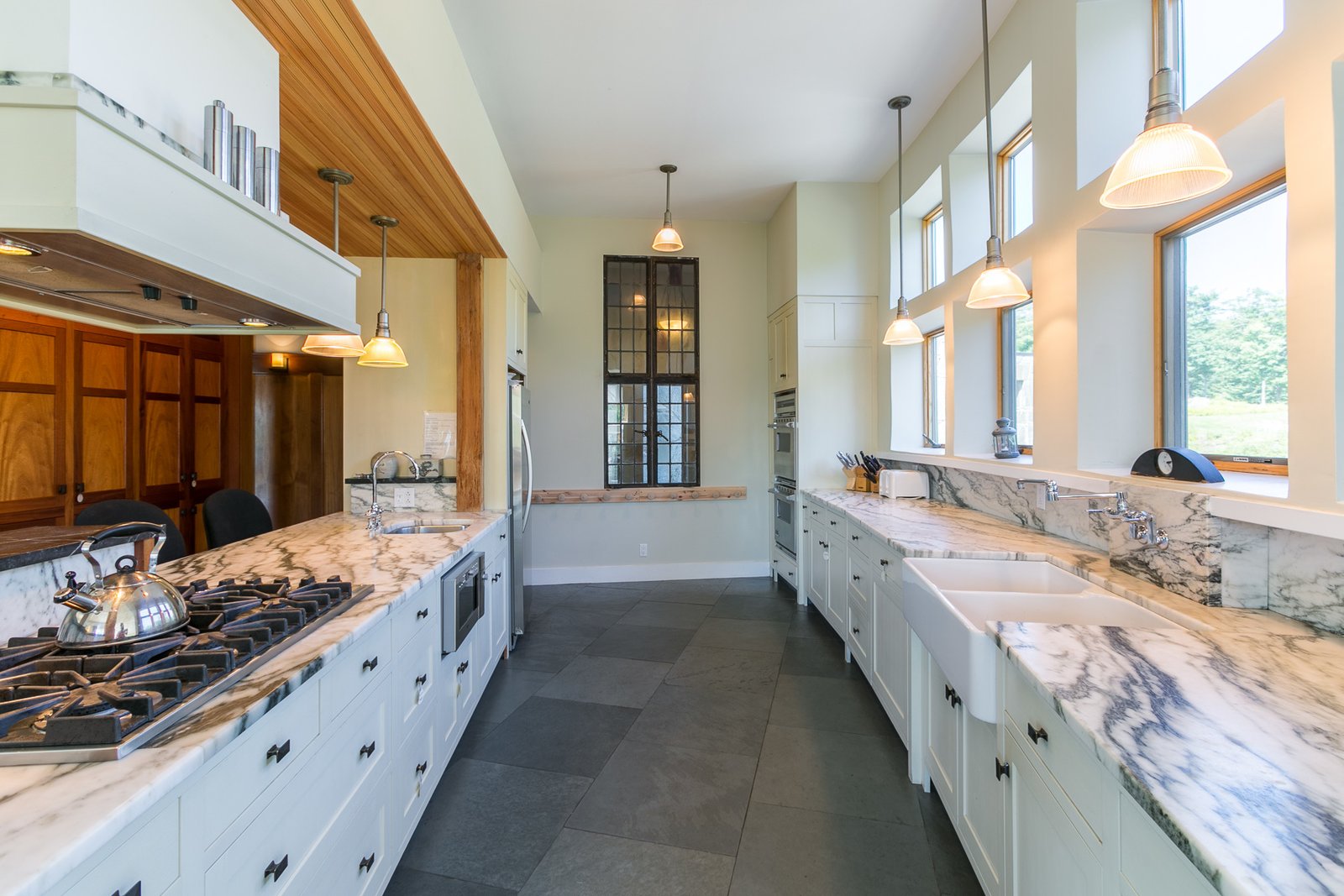 The kitchen's stunning marble countertops and slate floors.