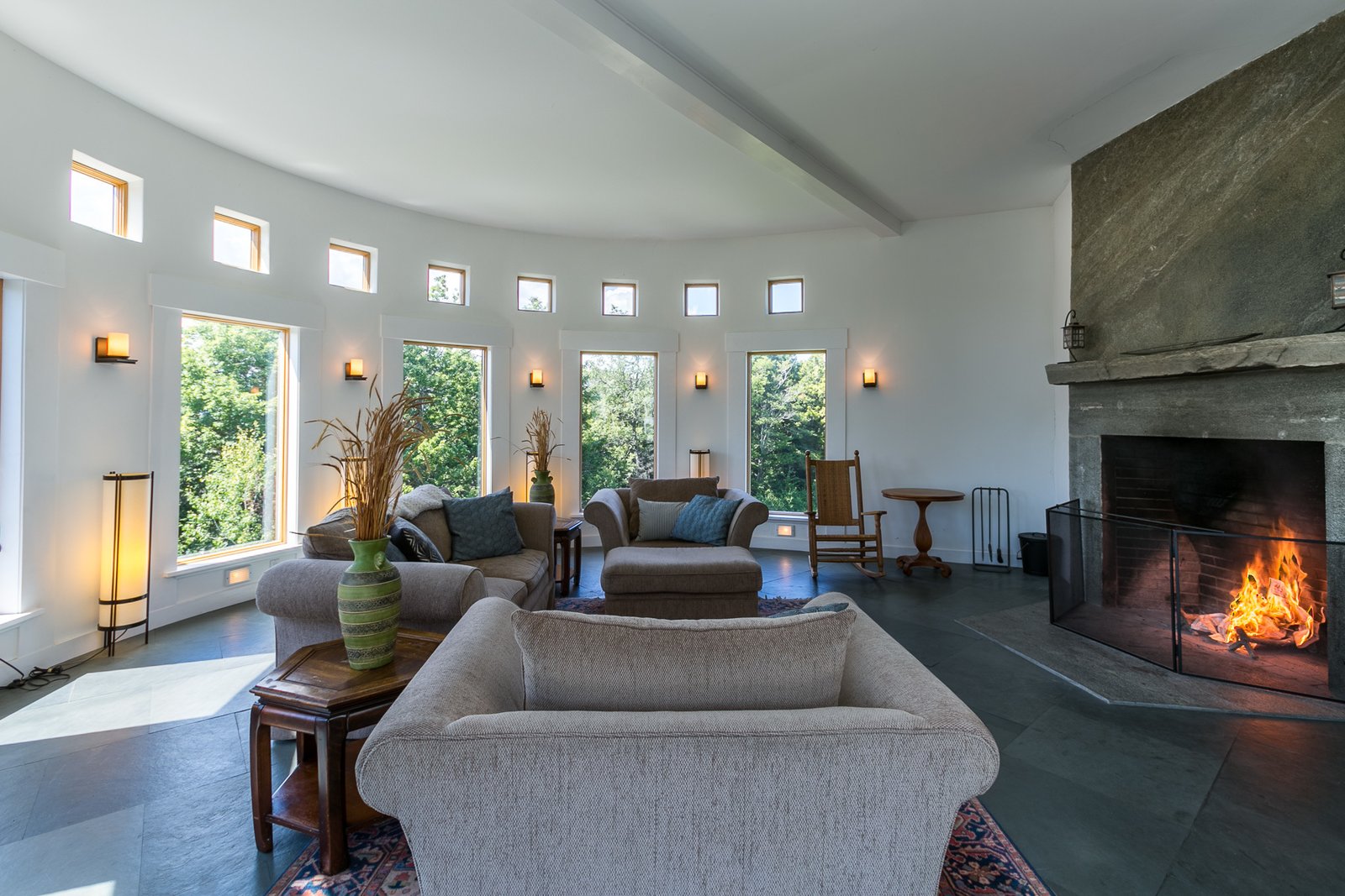 The circular living area features a granite fireplace.
