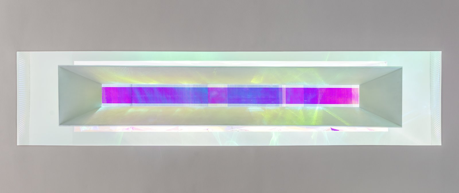 Within the main living space, a large 24' l x 4' w opening provides natural light into the deepest part of the living space. The sculptural element hanging within is covered in upward facing chromed tufts and a white flocked inner face; the form's opening is covered in a dichroic film and chromed lattice. Depending on the time of day and day of the year, the film produces different colors that reflect onto the walls and floor of the living space below.
