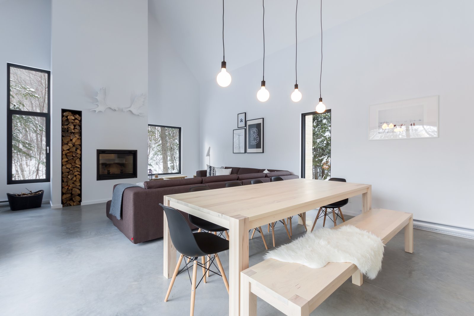The open area of the first floor with the fireplace and a massive sectionnal sofa is the perfect after-ski get together area,