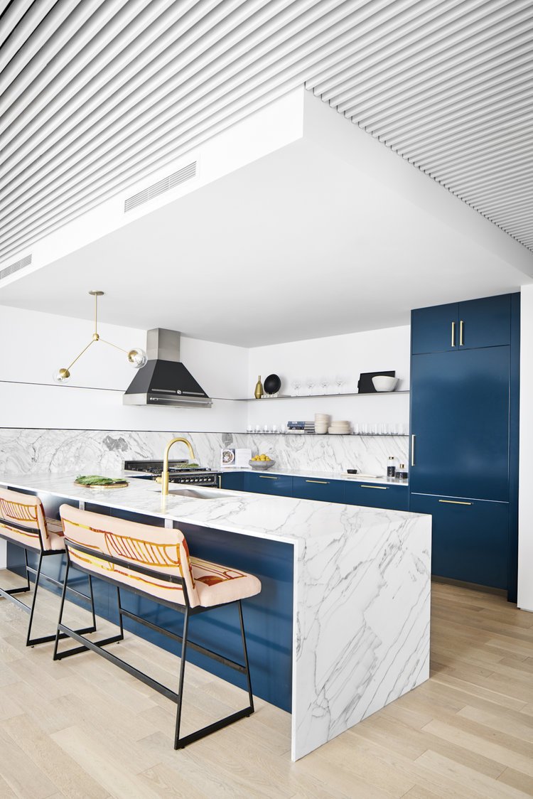 Kitchen Floating Steel Shelves and metal inlay on surrounding walls - Robert wanted a minimal kitchen. We passed on upper cabinets and opted for sleek floating metal shelves that wrapped around the walls with a 1/4" metal inlay on the surrounding walls. The metal perfectly complimented the already industrial feel of the unit.