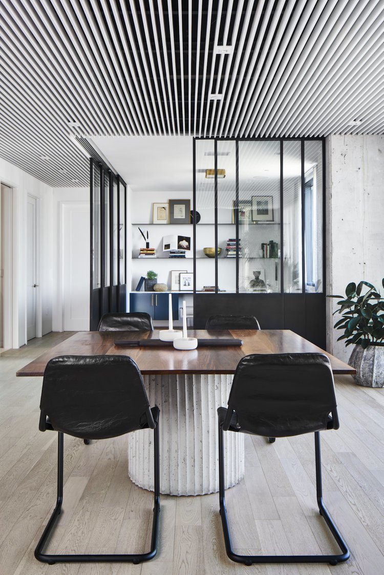 Suspended White Wood Slat Ceiling - We wanted to keep the ceilings as high as possible so rather than using drywall to enclose the ceiling, we used a suspended white wood slat ceiling detail. This added a unique architectural detail to the space, while also keeping the ceiling height as high as possible.