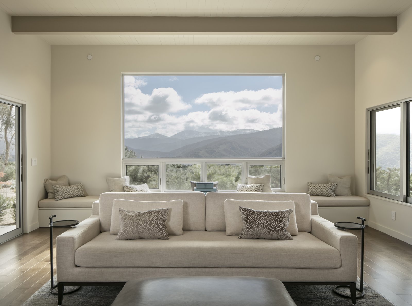 Windows on three sides of the living room take advantage of mountain and valley views.